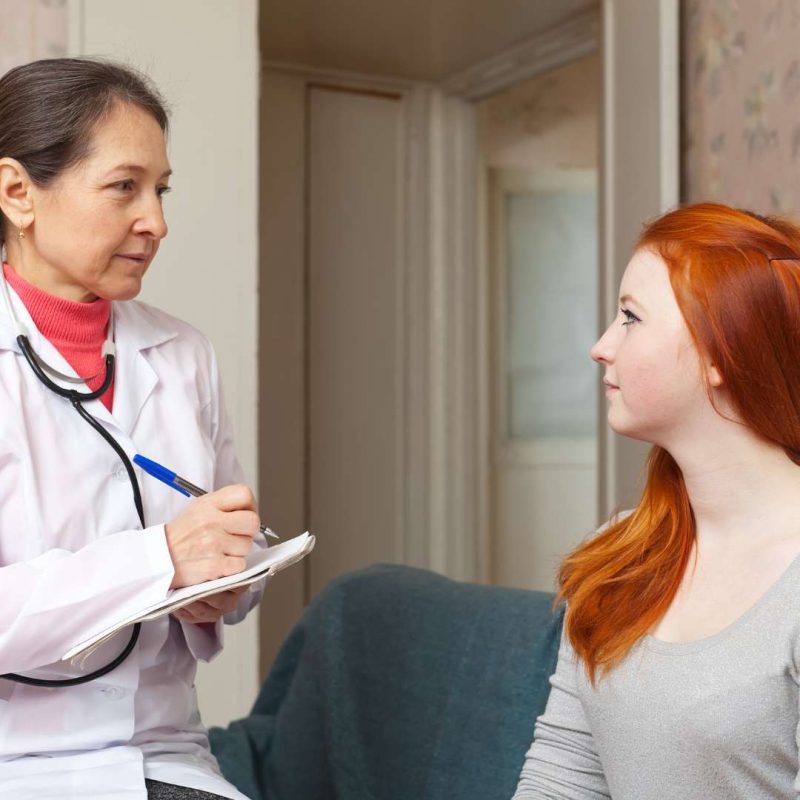 Silver State Adolescent Medication Treatment Doctor Assessing Teen Taking Notes