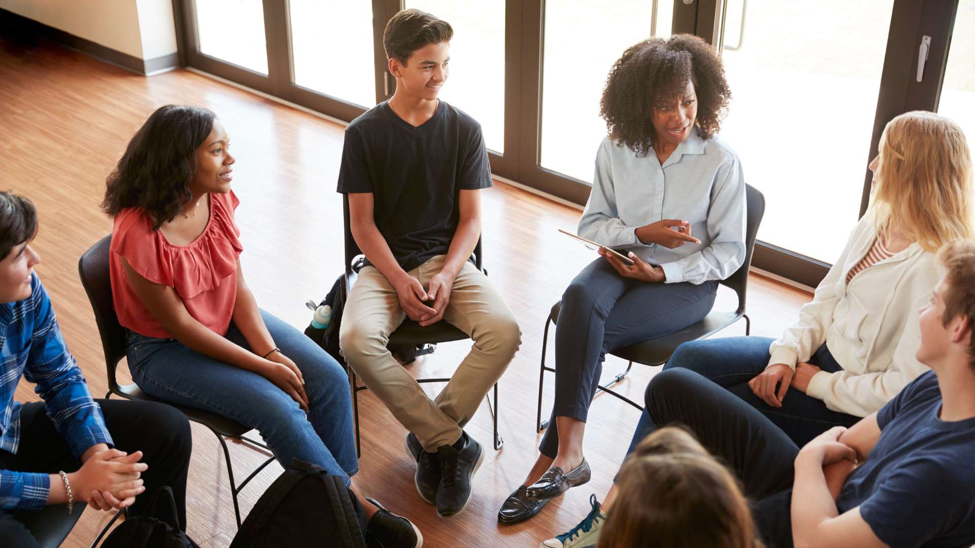 Silver State Adolescent Treatment Teen Group Therapy Session Led By Psychologist Talking