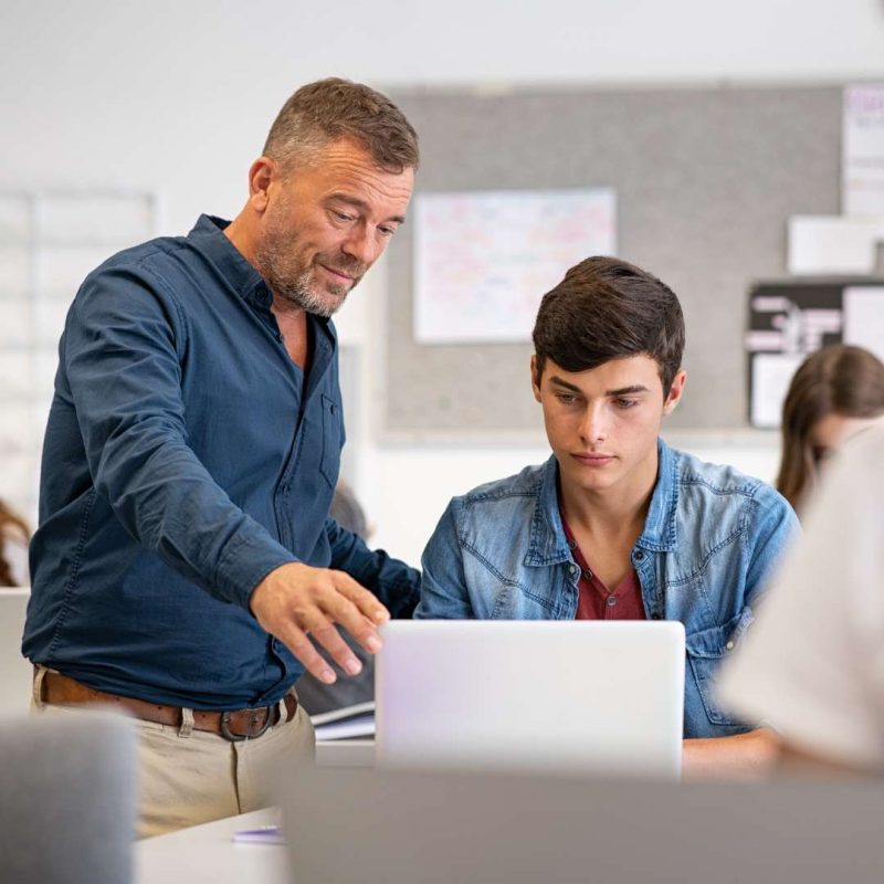 Silver State Youth Academy Classroom Teacher Instructing Student on Laptop